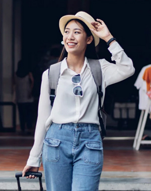 a woman carrying suitcase